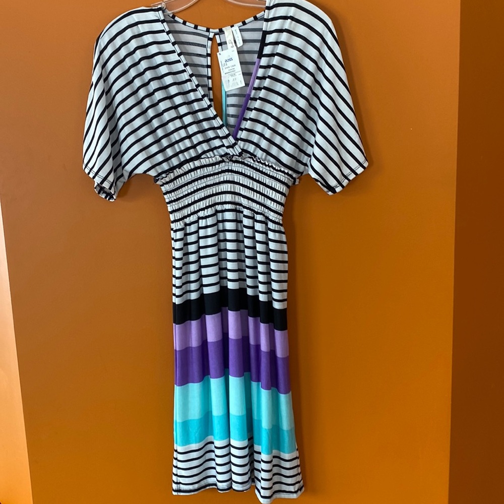 2/$20. Young lady’s comfy dress in size small made by Cristina love.